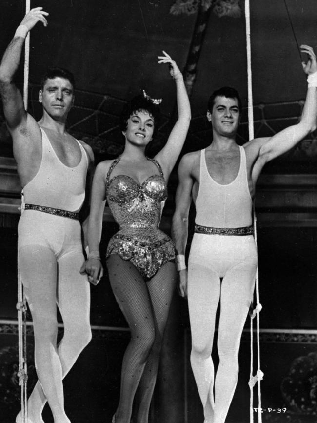 Actors Burt Lancaster (L), Gina Lollobrigida and Tony Curtis appear in a scene from the 1956 film 'Trapeze'.