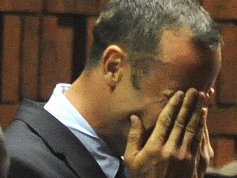 Athlete Oscar Pistorius weeps in court in Pretoria, South Africa, Friday, Feb 15, 2013, at his bail hearing in the murder case of his girlfriend Reeva Steenkamp. Oscar Pistorius arrived at a courthouse Friday, for his bail hearing in the murder case of his girlfriend as South Africans braced themselves for the latest development in a story that has stunned the country. The Paralympic superstar was earlier seen leaving a police station in a dark suit with a charcoal gray jacket covering his head as he got into a police vehicle. Model Reeva Steenkamp was shot and killed at Pistorius' upmarket home in an eastern suburb of the South African capital in the predawn hours of Thursday. (AP Photo/Antione de Ras - Independent Newspapers Ltd South Africa) SOUTH AFRICA OUT