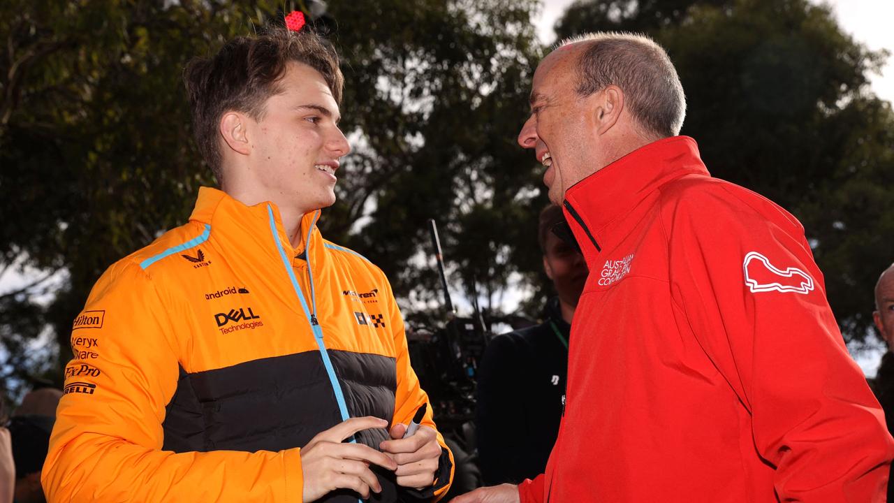 McLaren's Australian driver Oscar Piastri (L) talks with Andrew Westacott, CEO of Australian Grand Prix Corporation.