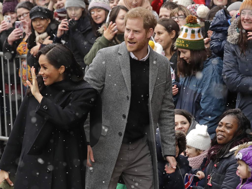 Britain's Prince Harry and Meghan, Duchess of Sussex waves to wellwishers as they arrive for a visit outside the Old Vic Theatre in Bristol, England. Picture: AP