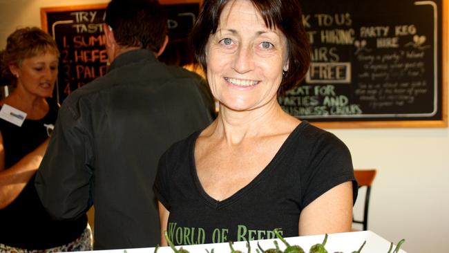 Brigid Curran of Sunshine Coast Brewery serves the roasted peppers at the 4556 Chamber of Commerce networking night at Kunda Park.