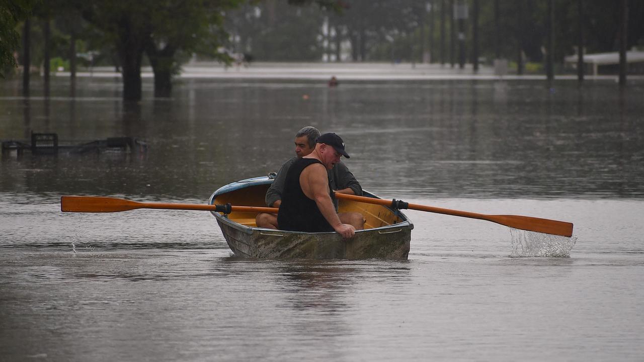 A pair row down Miles St, Ingham on Sunday. Picture: Cameron Bates