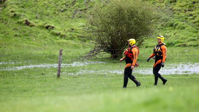 A swift-water response team at the dam in Echunga. Water leaking from the dam is visible. Picture: Kelly Barnes