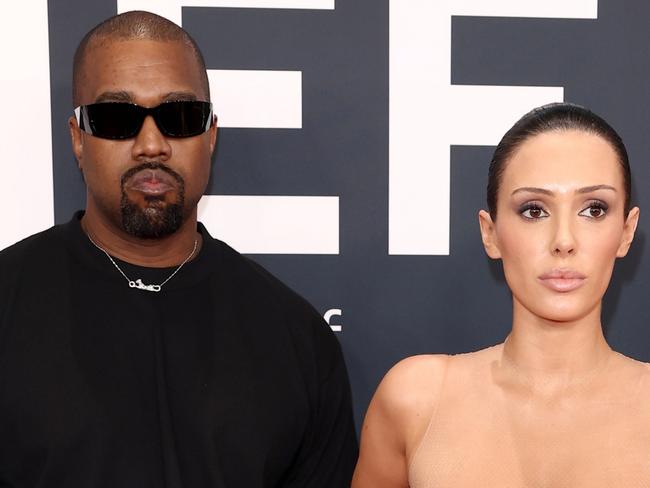 PIXELATED VERSIONS -  LOS ANGELES, CALIFORNIA - FEBRUARY 02: (EDITOR'S NOTE: Image contains nudity.) L-R, Kanye West and Bianca Censori attend the 67th Annual GRAMMY Awards on February 02, 2025 in Los Angeles, California.  (Photo by Matt Winkelmeyer/Getty Images for The Recording Academy)