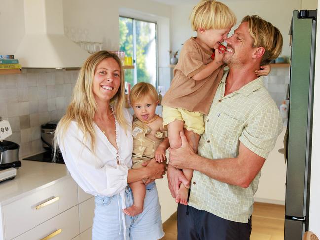 Daily Telegraph. 26, March, 2024.(story is about budget dinners and mortgage interest rates). Kara and Murray Bothma with their sons Shep, 9 months, and Oakes, 3, at home in Freshwater, today. Picture: Justin Lloyd.