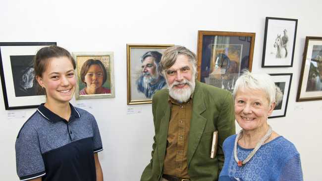 Sasha Willis (left) and Van Howell check out their portraits by Sandra Willis (not pictured) in the exhibition Synchronicity with Denise Hart at Culliford House, Saturday, November 2, 2019. Picture: Kevin Farmer