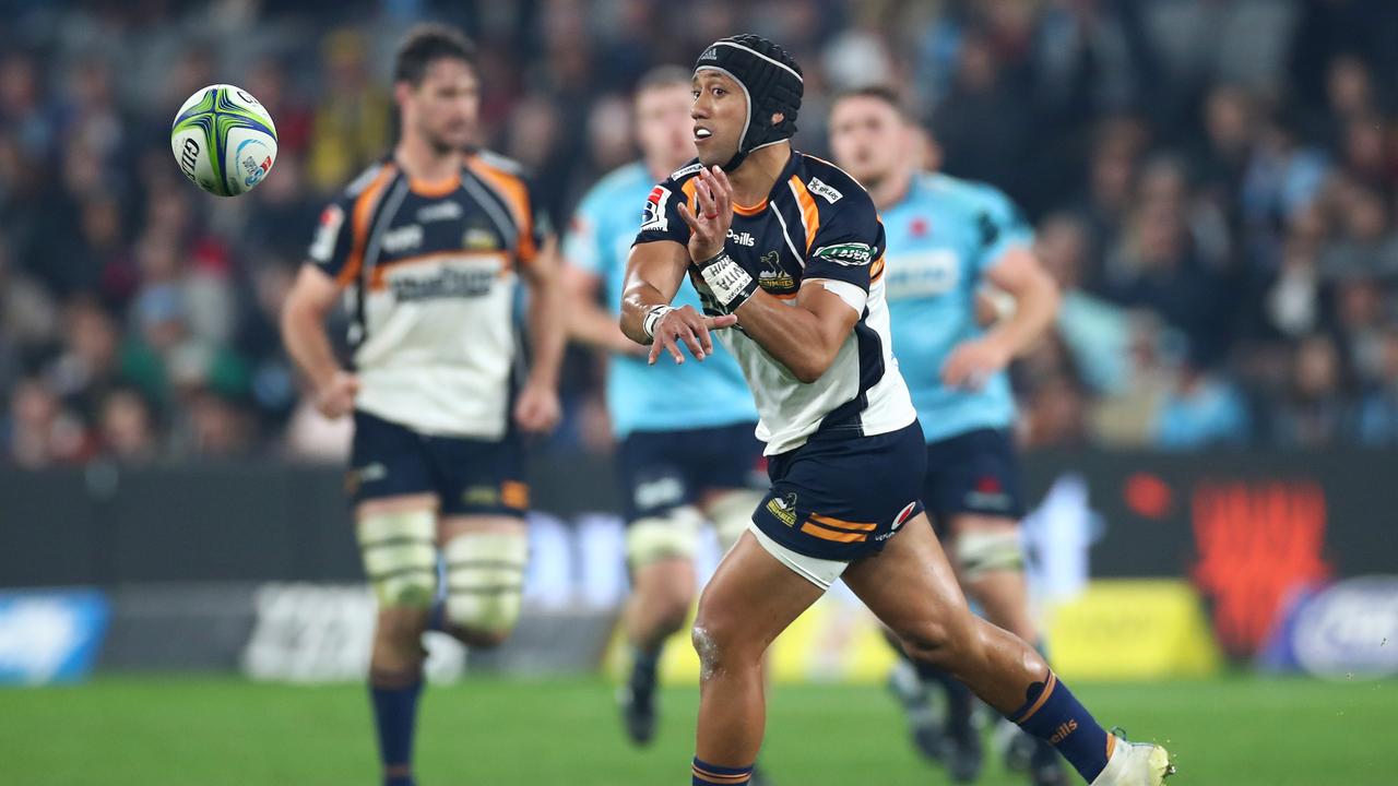 Christian Lealiifano of the Brumbies passes against the Waratahs.