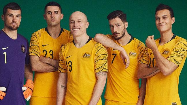 Socceroos players (l-r) Mat Ryan, Tom Rogic, Aaron Mooy, Mathew Leckie and Trent Sainsbury model the new home kit for the World Cup.