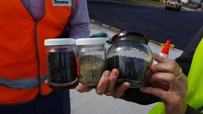 L-R jars of asphalt, crushed glass and a mix of toner and soft plastic.