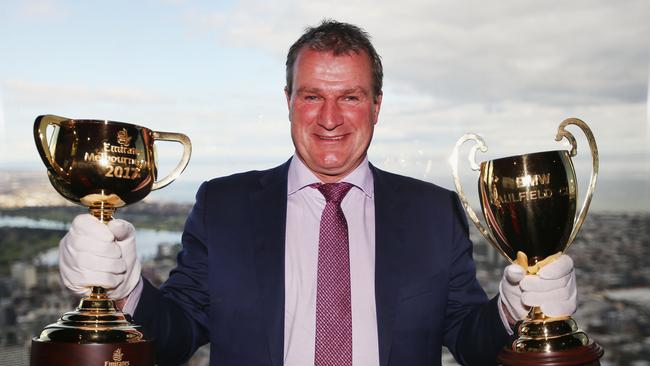 Darren Weir at Eureka Tower with the Melbourne Cup and Caulfield Cup. Picture: Getty