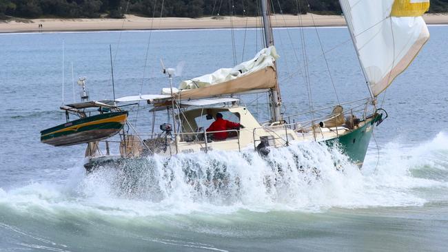 Coast Guard Mooloolaba had to tow a yacht into shore on Monday after after it hit a sand bar in attempt to enter the Mooloolah River mouth. Picture: Carmel Laxton