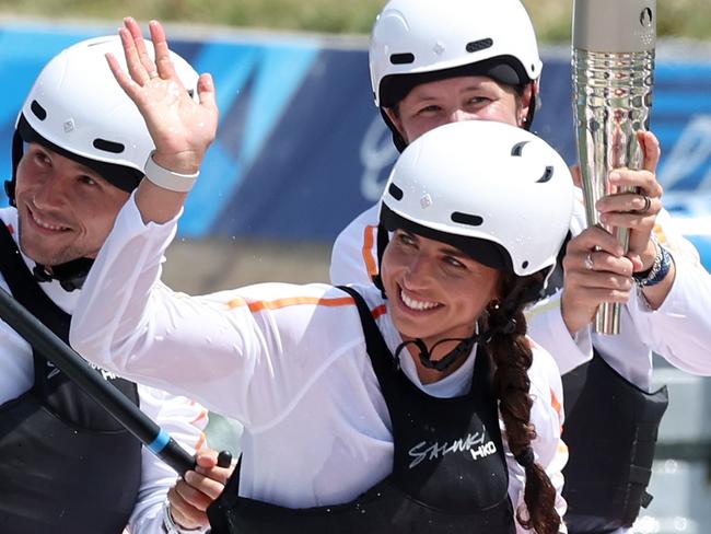 Paris Olympics 2024- Australian Olympic Canoe Slalom star Jess Fox takes part in the Paris Torch relay at Vaires-sur-Marne Nautical Stadium. Pics Adam Head