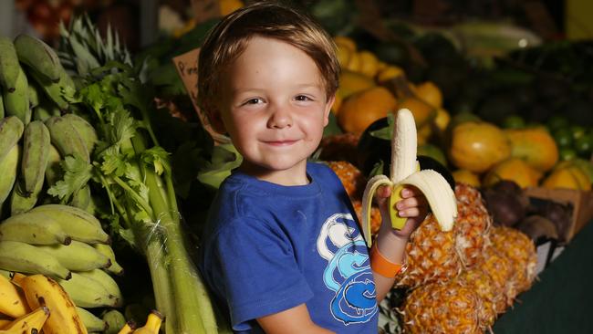 Jonah Woodford, 4, at Rusty's Markets. Wayne says the markets began with some hippies but after they left town, his father kept them going. PICTURE: STEWART MCLEAN