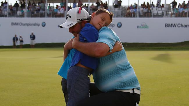Marc Leishman hugs his two sons after his win in the BMW Championship. Picture: Getty Images