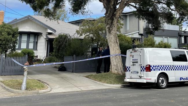 A Mary St home in Spotswood is cordoned off after police arrest a man over the alleged disturbance of Footscray graves.