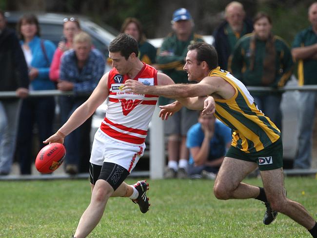 KInglake v Olinda-Ferny Creek played football at Marysville to help the local community. Kinglake forgot their footy jumpers and had to play in Marysville jumpers - yellow with green vertical stripes. A crowd of about 250 only turned up. ringing the oval with their cars and watching from the back of pick up trucks.Kinglake is yellow vertical stripes..