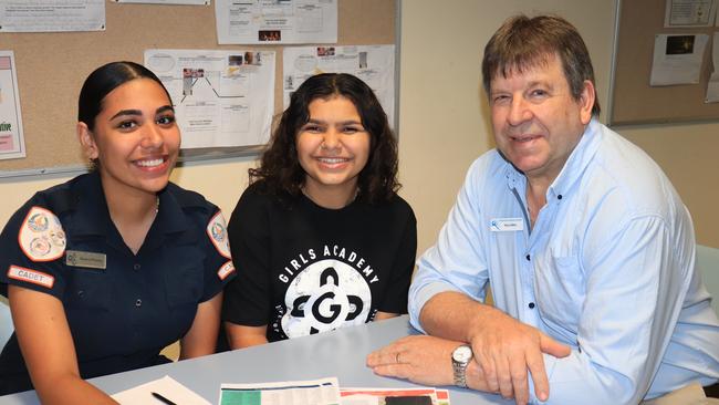 Centralian Senior College Principal Tony Collins with Year 12 graduates Shania and Rekeah.