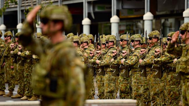 Darwin-based 5th Battalion, Royal Australian Regiment, salute dignitaries as they exercised their Freedom of Entry to the City of Darwin, marching from Darwin City Council to the Darwin Cenotaph. Picture: MICHAEL FRANCHI