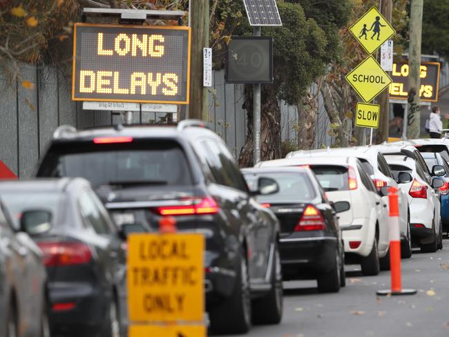 People queue up in their cars for Covid testing at the Melbourne Showgrounds in Flemington. Picture: David Crosling / NCA NewsWire