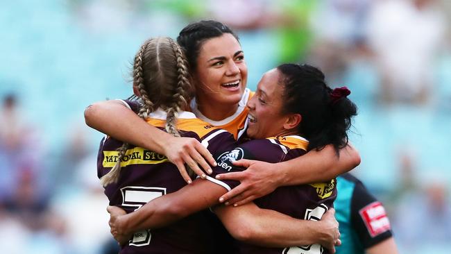 Millie Boyle celebrates with Ali Brigginshaw (left) and Amy Turner (right) after winning the 2019 NRLW grand final match. Picture: Matt King/Getty Images