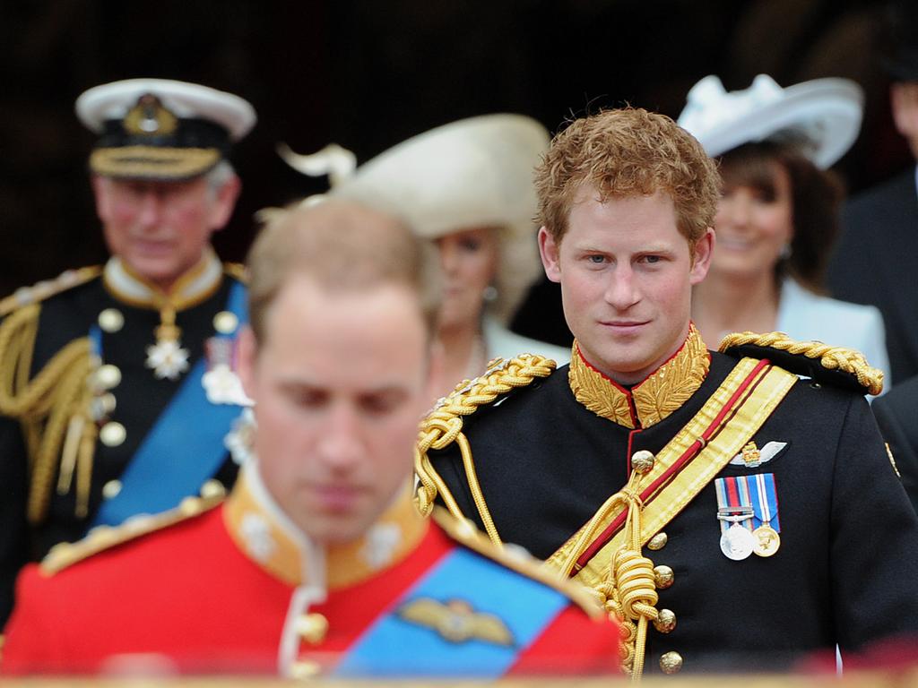 Britain's Prince Harry (C) leaves Westminster Abbey in London with his “frostbitten penis”, after the wedding ceremony of his brother Prince William (L) and Kate Middleton, on April 29, 2011. Picture: AFP / Carl De Souza.