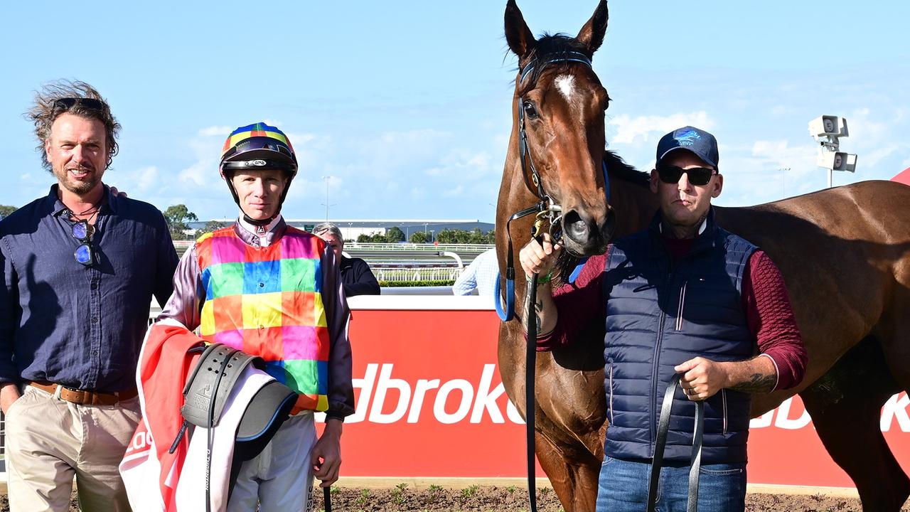 Supplied Editorial Jeff Allis (left) celebrates the win of Tiger Shark at Doomben.
 Picture: Grant Peters - Trackside Photography