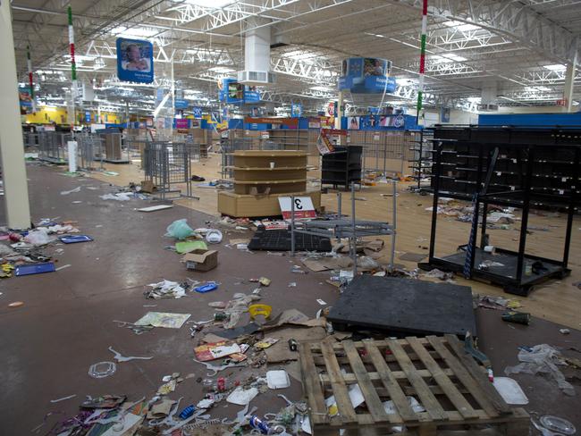 Debris litters the floor of a Wal-Mart superstore.