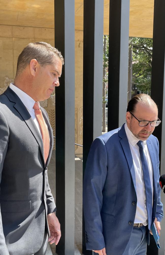 Timothy Lawrence Shepherd, Ipswich police officer charged with driving under the influence, leaving the Ipswich Courthouse on February 1 accompanied by his lawyer Calvin Gnech. Picture: Nicola McNamara