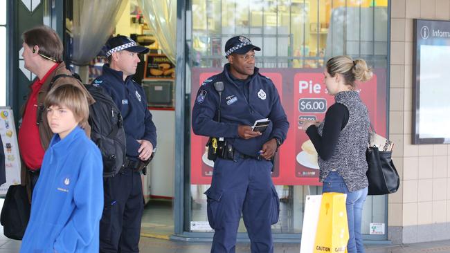 Police outside Helensvale Train Station. Picture Glenn Hampson