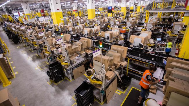 Workers prepare orders for shipment at the Amazon.com centre in Passo Corese, Italy. Picture: Bloomberg