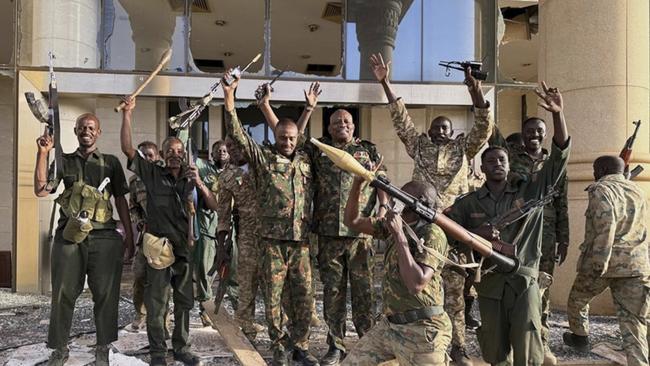 Sudanese soldiers celebrate outside the palace in Khartoum. Picture: Sudanese Armed Forces via AP