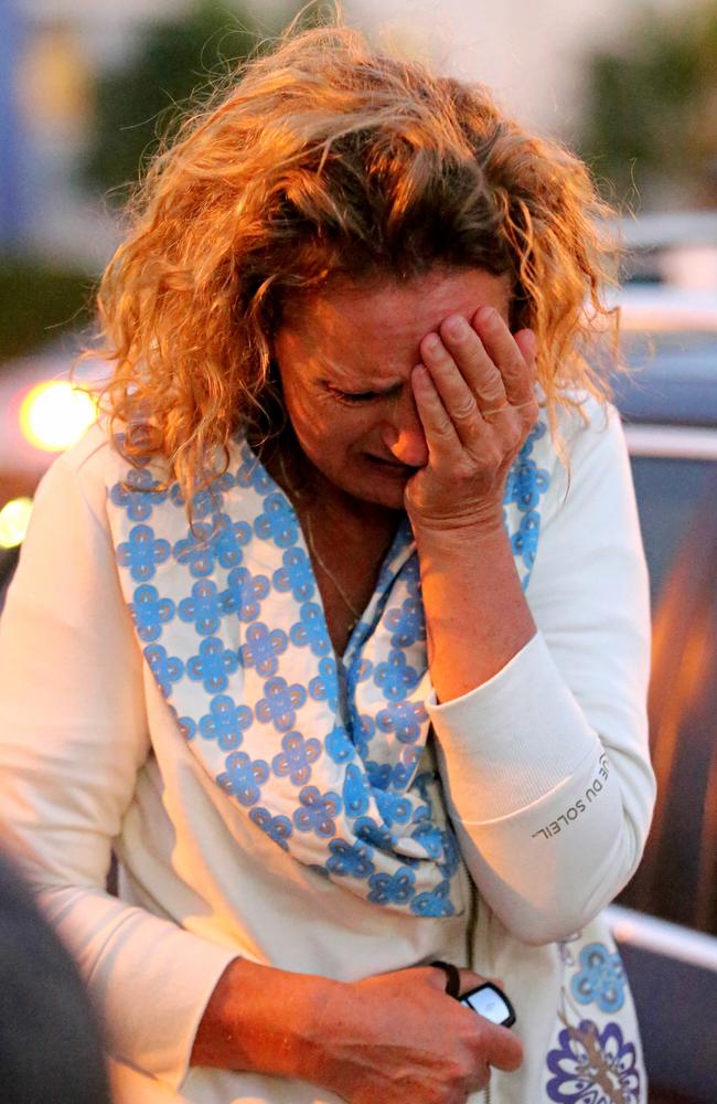 Resident Zaza Silk breaks down as she sees her home this morning. Picture: John Grainger