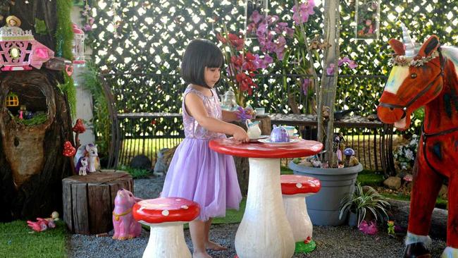 FAIRY LAND: Abbey Joyce Tydd loves the fairy garden her parents built for her. Picture: Jann Houley