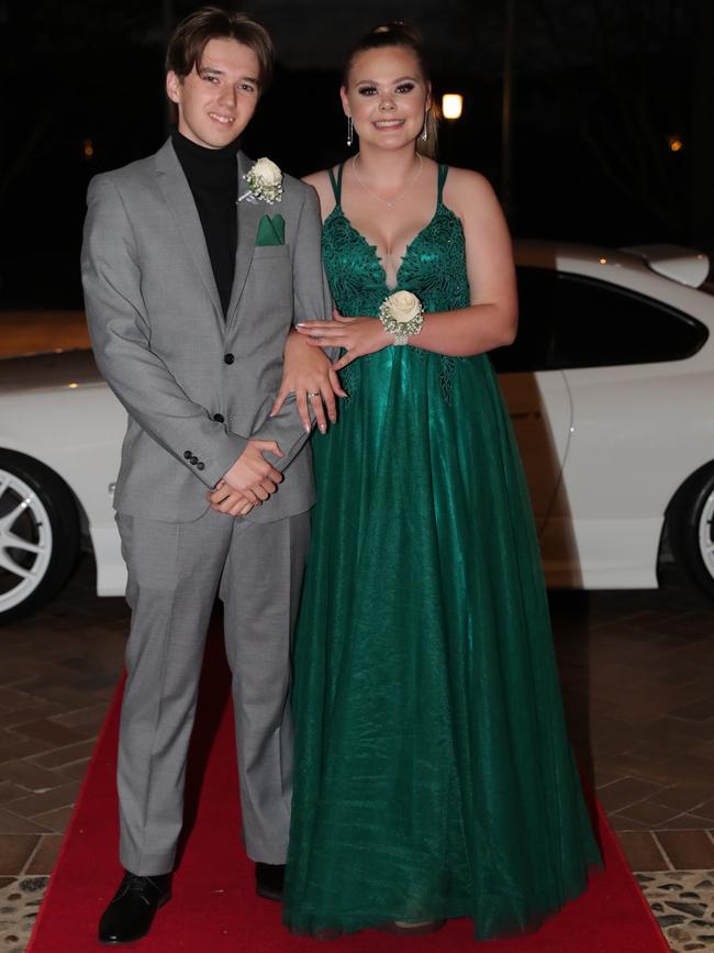 Caitlyn van Beest, 17, and Finn Morgan, 17, at the Ormeau Woods School formal at Links Resort, Hope Island. Picture: Glenn Hampson