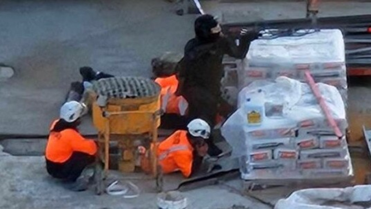 Tradies seen ducking for cover during a suspected shooting in Auckland. Picture: Stuff.co.nz