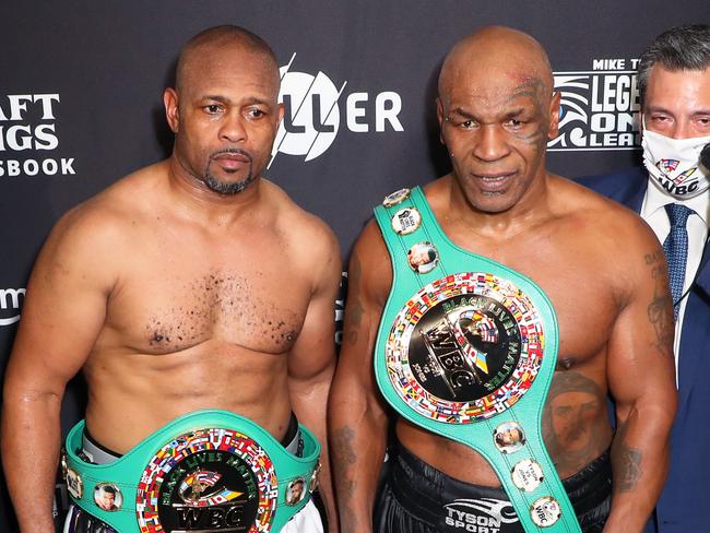 LOS ANGELES, CALIFORNIA - NOVEMBER 28: Roy Jones Jr. (3L) and Mike Tyson (C) celebrate their split draw during Mike Tyson vs Roy Jones Jr. presented by Triller at Staples Center on November 28, 2020 in Los Angeles, California. (Photo by Joe Scarnici/Getty Images for Triller)