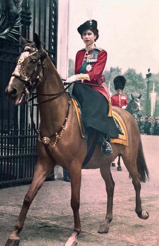 The then- Princess Elizabeth photographed on her arrival back at the Palace ceremonies.