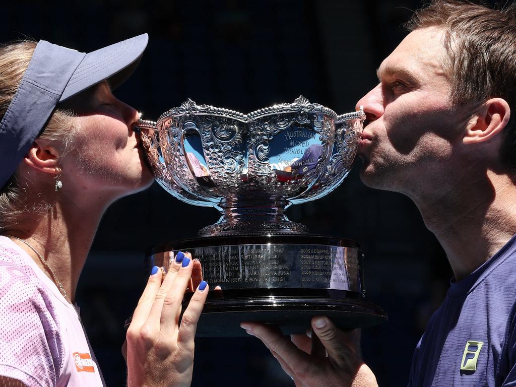 Australia's Olivia Gadecki and John Peers celebrate with the trophy after winning the mixed doubles title at the Australian Open. Picture: AFP