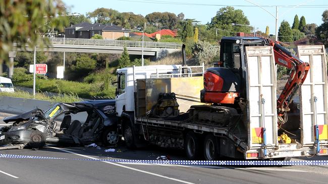 A mangled car litters the road after the crash last night. Picture: Yuri Kouzmin