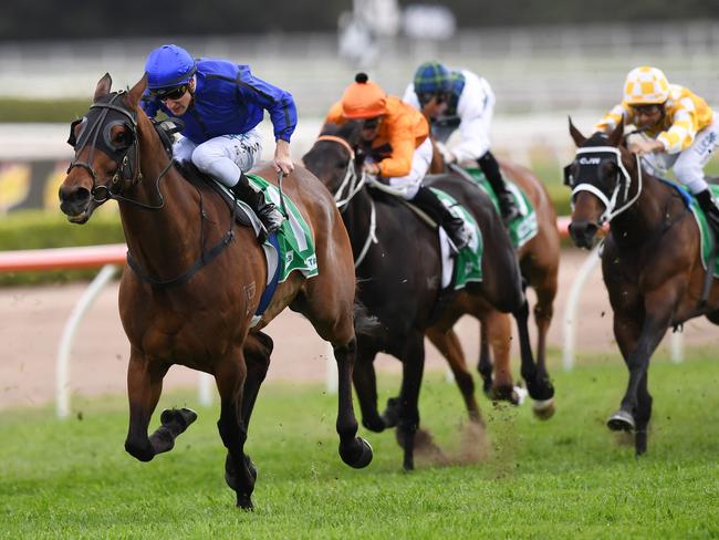 Happy Clapper (left) wins the TAB Epsom Handicap at Randwick.