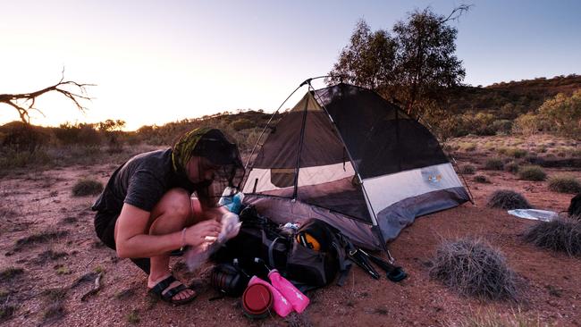 Bell setting up camp along the Larapinta trail in the Northern Territory. Picture: Chris Huang