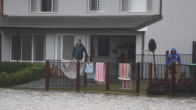 Sydney homes remained surrounded by water. Picture: John Grainger