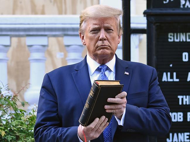 Donald Trump holds a Bible outside of St John's Episcopal church in Washington. Picture: AFP