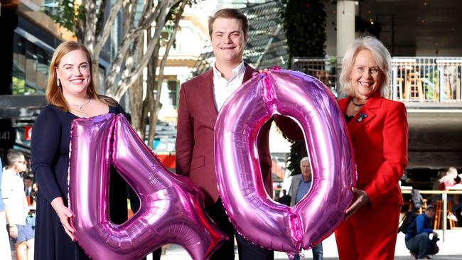 L to R, Hannah &amp; James White from Robert White Jewellers with Di Cant at the Queen Street Mall’s 40th birthday celebrations in 2022. Picture: Steve Pohlner