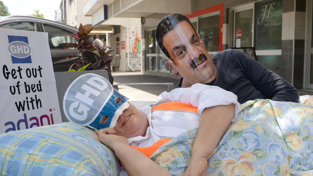 Mackay Conservation Group staged a protest outside the Wood St offices of GHD to protest the company's alleged involvement with Adani. Protester Lesley Keegan, dressed as GHD, next to Gautam Adani, played by Peter McCallum.