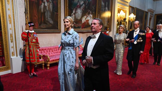 Ivanka Trump and Britain's International Trade Secretary Liam Fox arrive through the East Gallery during a State Banquet in the ballroom at Buckingham Palace.