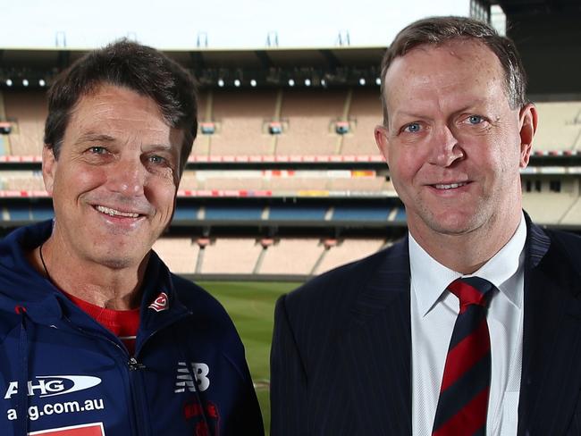 MELBOURNE, AUSTRALIA - AUGUST 26:   Paul Roos, Senior Coach of the Demons and Melbourne Demons President Glen Bartlett during a Melbourne Demons media conference at the Melbourne Cricket Ground on August 26, 2016 in Melbourne, Australia.  Roos held his final media conference as senior coach of the Demons. (Photo by Scott Barbour/AFL Media)