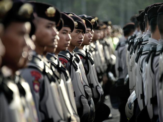 Indonesian anti-riot police take part in a roll call in Jakarta on December 22, 2016, as part of efforts to secure Christmas and New Year celebrations. Picture: AFP / Bay Ismoyo