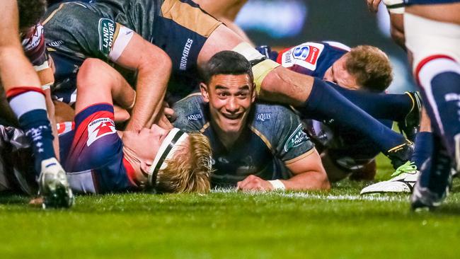 Wharenui Hawera celebrates scoring against the Rebels.