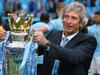 MANCHESTER, ENGLAND - MAY 11: The Manchester City Manager Manuel Pellegrini poses with the Premier League trophy at the end of the Barclays Premier League match between Manchester City and West Ham United at the Etihad Stadium on May 11, 2014 in Manchester, England. (Photo by Alex Livesey/Getty Images)